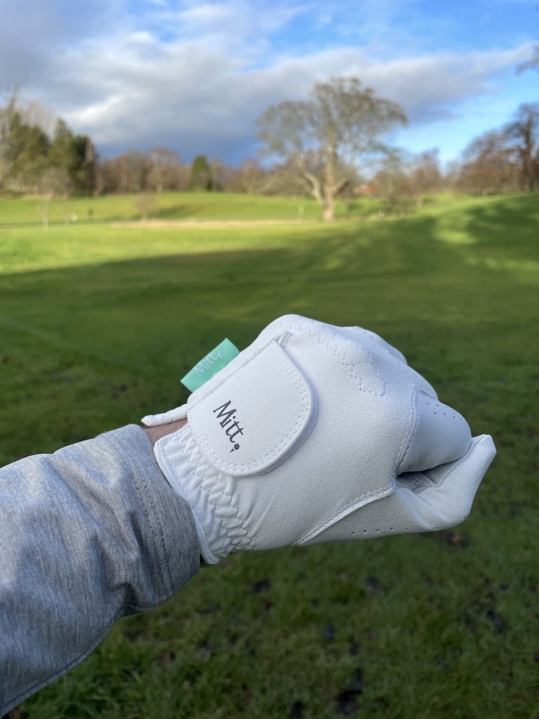 Mitt Golf glove being worn on the left hand with a clenched fist - showing the Mitt logo