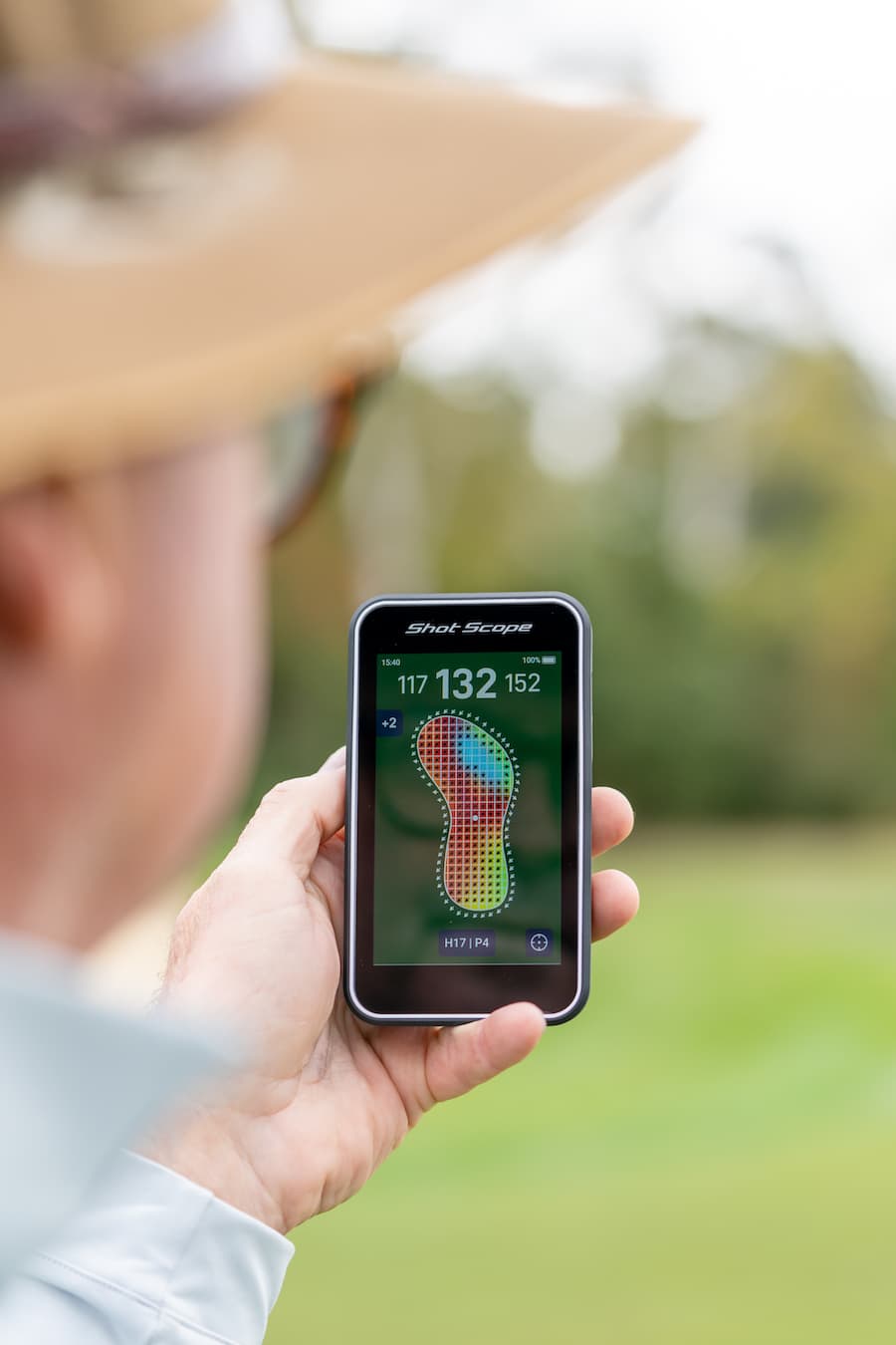 Shot Scope H50 Handheld on the golf course displaying the green map with undulations