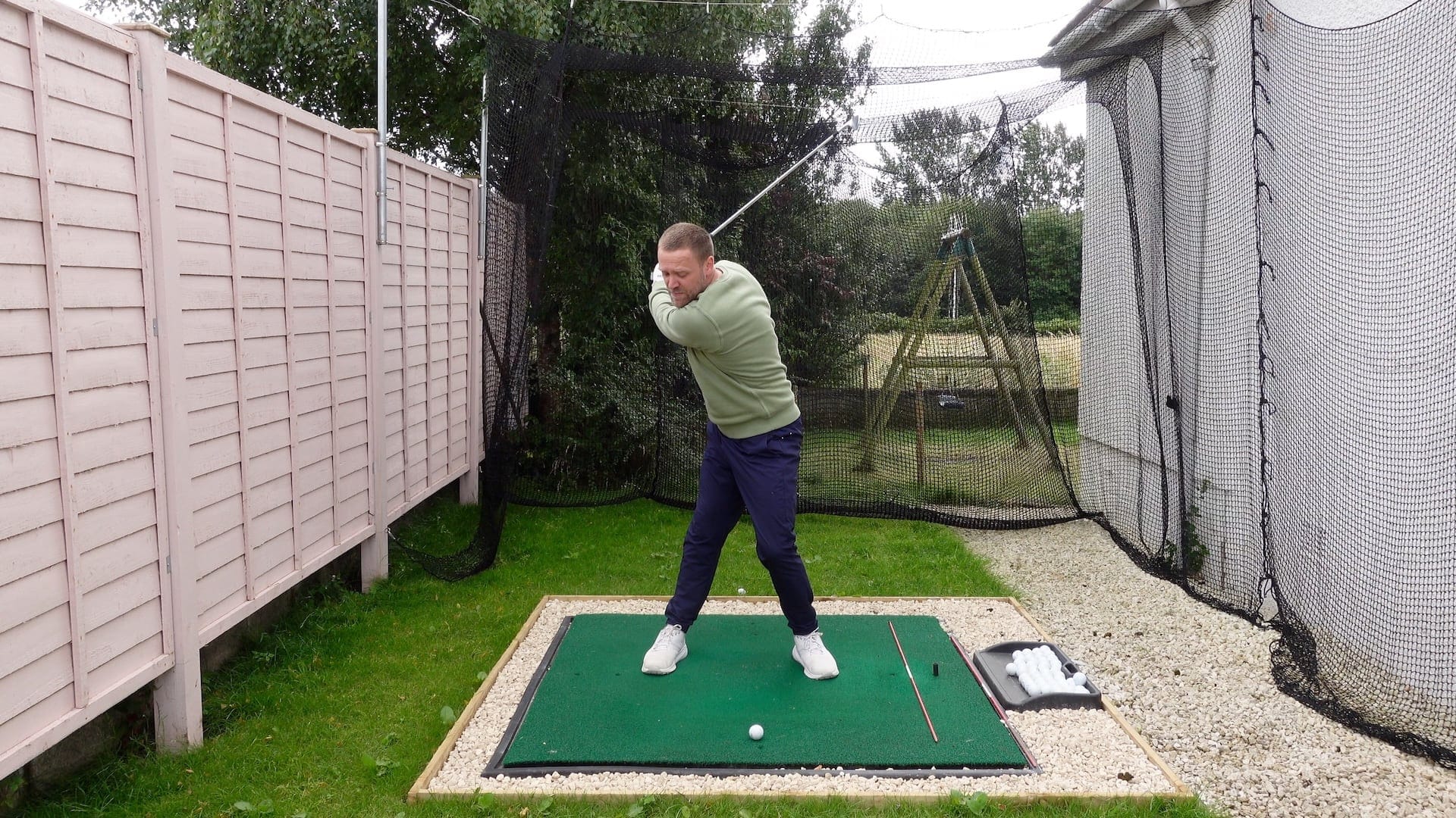 golfer in better golf backswing position at top of the backswing