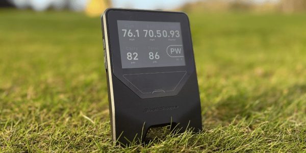 Shot Scope LM1 launch monitor on grass on golf course