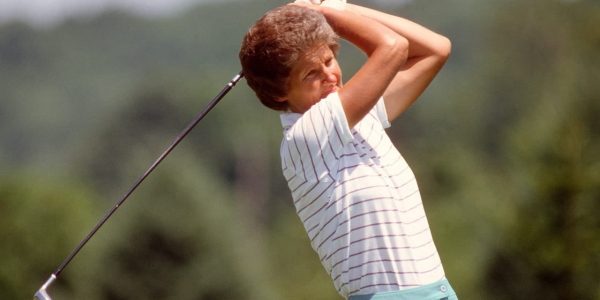 Old image of Kath Whitworth swinging a wood